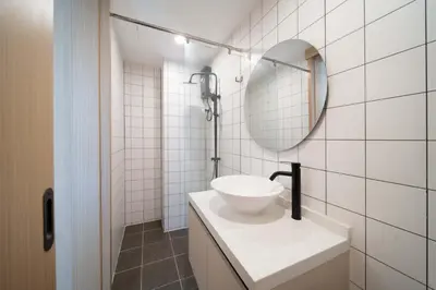 a white bathroom with a sink and a mirror at now condo near beach 2bedroom in Kamala Beach