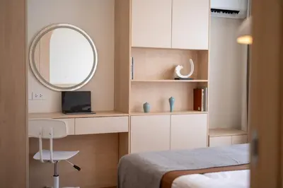 a bedroom with a desk and a mirror and a bed at now condo near beach 2bedroom in Kamala Beach