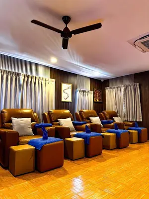 a living room with couches and chairs and a ceiling fan at Water Lily Spa Bungalows by Rawai Beach in Rawai Beach