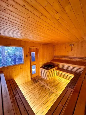 an inside view of a wooden cabin with a bed in it at Water Lily Spa Bungalows by Rawai Beach in Rawai Beach