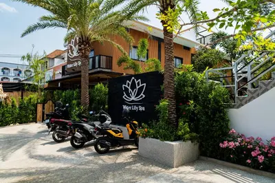 two motorcycles parked in front of a building at Water Lily Spa Bungalows by Rawai Beach in Rawai Beach