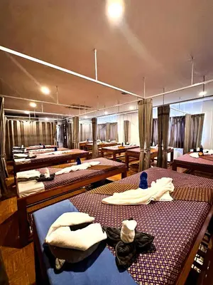 a room with rows of tables with towels on them at Water Lily Spa Bungalows by Rawai Beach in Rawai Beach