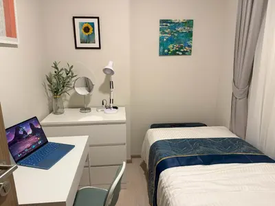 a small room with a desk with a laptop on it at THE BASE Rise Resort Style 1 & 2 Bedrooms in Ban Rangeng