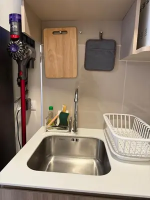 a kitchen with a sink in a tiny caravan at THE BASE Rise Resort Style 1 & 2 Bedrooms in Ban Rangeng