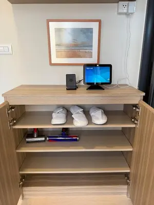 a wooden shelf with a computer on it at THE BASE Rise Resort Style 1 & 2 Bedrooms in Ban Rangeng