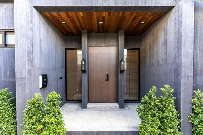 a entrance to a building with a brown door at Chariot by Villacarte in Layan Beach