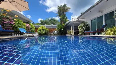 a swimming pool in the backyard of a house at Villa 320m2 Piscine privée 4 chambres à Kamala in Kamala Beach