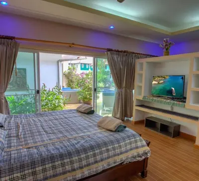 a bedroom with a bed and a large window at Villa 320m2 Piscine privée 4 chambres à Kamala in Kamala Beach