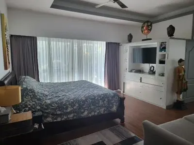 a bedroom with a bed and a large window at Villa 320m2 Piscine privée 4 chambres à Kamala in Kamala Beach