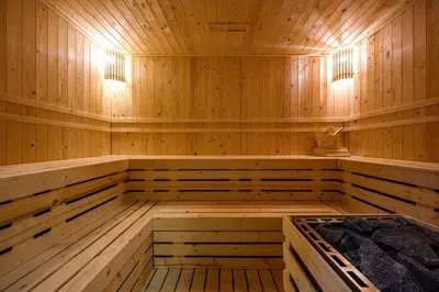 an empty sauna with wooden walls and wooden floors at Seaview, cozy apartment, Surin in Surin Beach