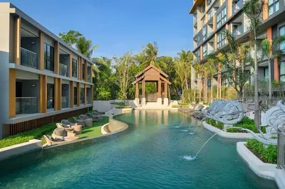 a swimming pool in the middle of a building at Seaview, cozy apartment, Surin in Surin Beach