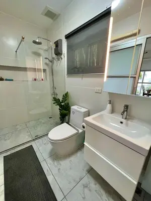a bathroom with a toilet and a sink and a shower at Villa Miyoko Ko Yao Noi Enjoy nature's beauty and stunning sunsets in Ko Yao Noi