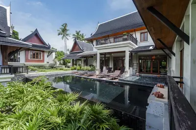 an external view of a villa with a swimming pool at Salika Luxury 5.5 Bed Villa Seaview With Maids in Rawai Beach