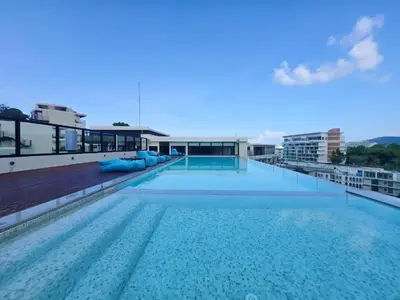 a large swimming pool on the roof of a building at Brand New 2 Bed Seaview Apartment Utopia Karon in Karon Beach
