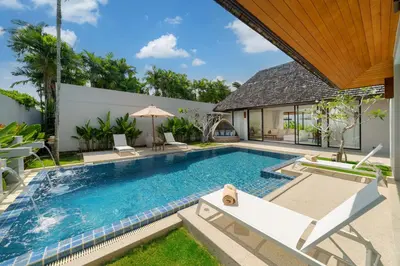 an image of a swimming pool in a villa at Anchan Villas Phuket - 4 BR Signature Pool Villa by Escape Villas in Ban Phru Champa