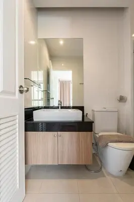 a bathroom with a sink and a toilet at The Lago by Villacarte in Rawai Beach
