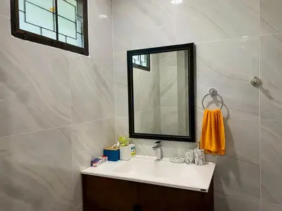 a bathroom with a sink and a mirror at Cozy Space Kamala in Kamala Beach
