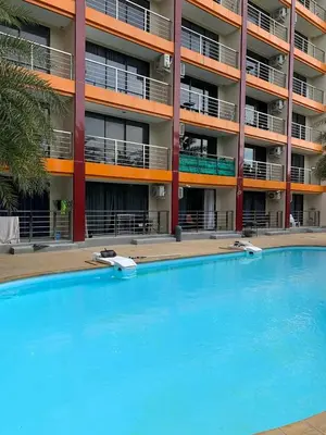 an empty swimming pool in front of a building at СС619 Романтика, чудесный вид и домашний уют in Mai Khao Beach