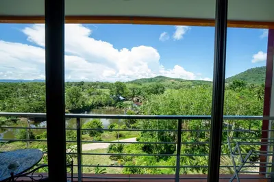 a view from the window of a house at СС619 Романтика, чудесный вид и домашний уют in Mai Khao Beach