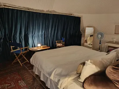 a hotel room with a bed and a table and chairs at NATUR - Krabi Campsite Glamping & Camping in Krabi town