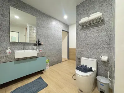 a bathroom with a toilet and a sink and a mirror at Tropical Living Kamala Hillside in Kamala Beach