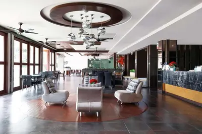 a lobby with chairs and tables in a building at Stylish Stay, Quiet Vibe - Apartment RGN B411 in Bangtao in Bang Tao Beach