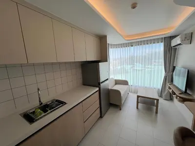 a small kitchen with a sink and a refrigerator at FANTASEA KAMALA NEW 1 BEDROOM & Living Room Balcony in Kamala Beach