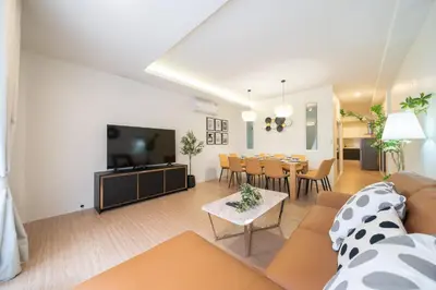 a living room with a couch and a table at Beachside Patong 50m or less min walk in Patong Beach