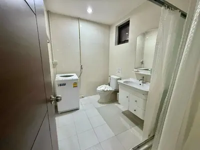 a bathroom with a toilet and a sink at апартаменты NBC Nai Harn in Rawai Beach