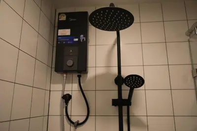 a cell phone hooked up to a wall at Apartment by the sea Kamala Beach A502 in Kamala Beach