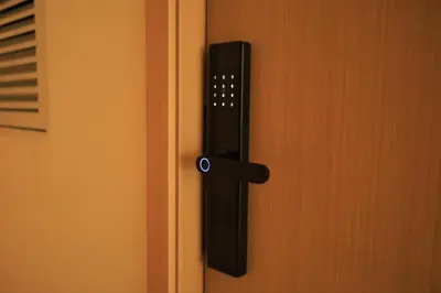 a black door handle on a wooden door at Apartment near the sea Kamala beach 601 in Kamala Beach