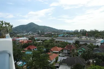a view of a town with a mountain in the background at Apartment near the sea Kamala beach 601 in Kamala Beach