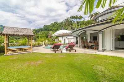 a backyard with a gazebo and a pool at Luxurious & Quiet Pool Villa Orchid in Nai Yang Beach