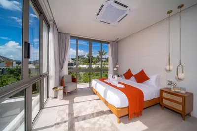 a hotel room with a bed and a large window at Coconus Pool Villa \u963f\u4e3d\u838e \u6cf3\u6c60\u522b\u5885 in Ban Pak Lak