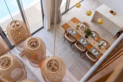 an overhead view of a dining room table and chairs at Coconus Pool Villa \u963f\u4e3d\u838e \u6cf3\u6c60\u522b\u5885 in Ban Pak Lak