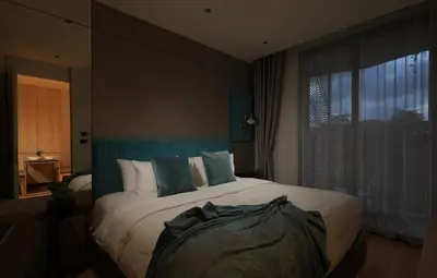a bedroom with a large bed and a window at New 1bdr Apartment Layan C518 in Ko Kala