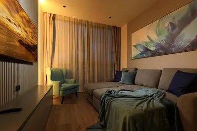 a living room with a couch and a chair at New 1bdr Apartment Layan C518 in Ko Kala