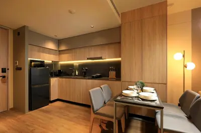 a kitchen and dining room with a table and chairs at New 1 bdr Apartment near Layan beach C610 in Ko Kala