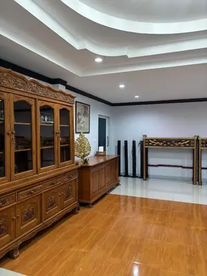 a large room with a large wooden cabinet at Spacious and cozy Thai House in Ban Bang Khu