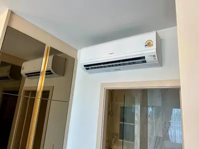 a kitchen with a air conditioner on the ceiling at Bellevue lagoon 20 units in Laguna Phuket
