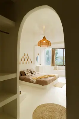 a bedroom with a bed and a large window at The hidden home in Patong Beach