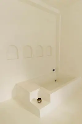 a white room with a sink in the middle of it at The hidden home in Patong Beach