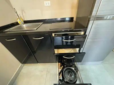 a small kitchen with a sink and a stove at Condo for rent chalong rawai 305 in Ban Klang