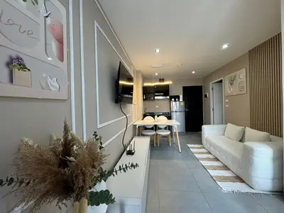 a living room with a couch and a table at Condo for rent chalong rawai 305 in Ban Klang