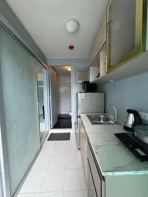 a kitchen with a sink and a counter top at Dcondo kathu phuket in Kathu