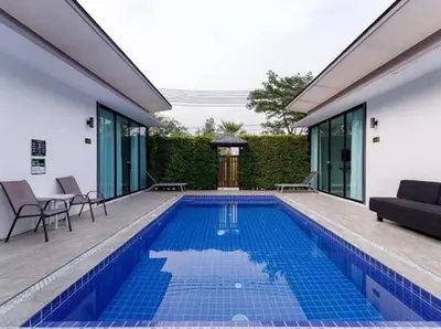 a swimming pool in the backyard of a house at The COZY NATURE pool villas phuket in Koh Lone