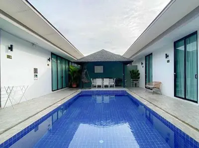 a large swimming pool in a building with at The COZY NATURE pool villas phuket in Koh Lone