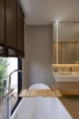 a bathroom with a tub and a sink and a mirror at Le Da Villas 5BR Private Pool Villa, Bangtao Beach Phuket in Laguna Phuket