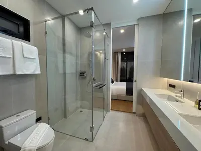 a bathroom with a shower and a toilet and a sink at Le Da Villas 5BR Private Pool Villa, Bangtao Beach Phuket in Laguna Phuket