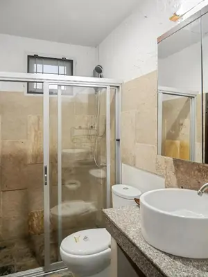 a bathroom with a sink and a toilet and a shower at 3 Bedrooms - 2 floor with garden in Prime Location in Thalang
